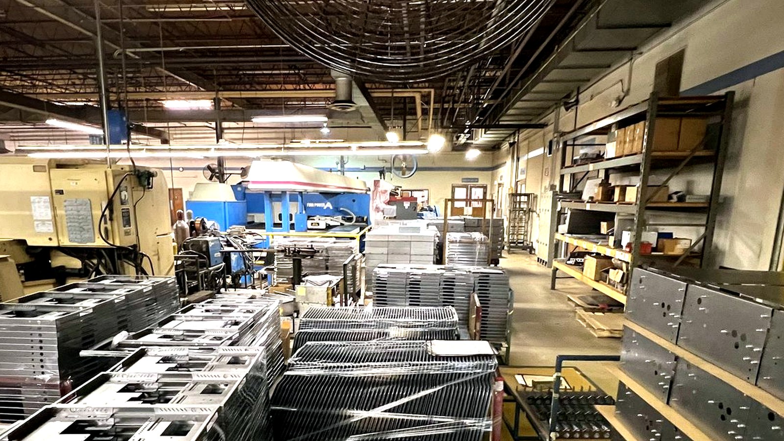 PCI production floor with staged fabricated parts and equipment